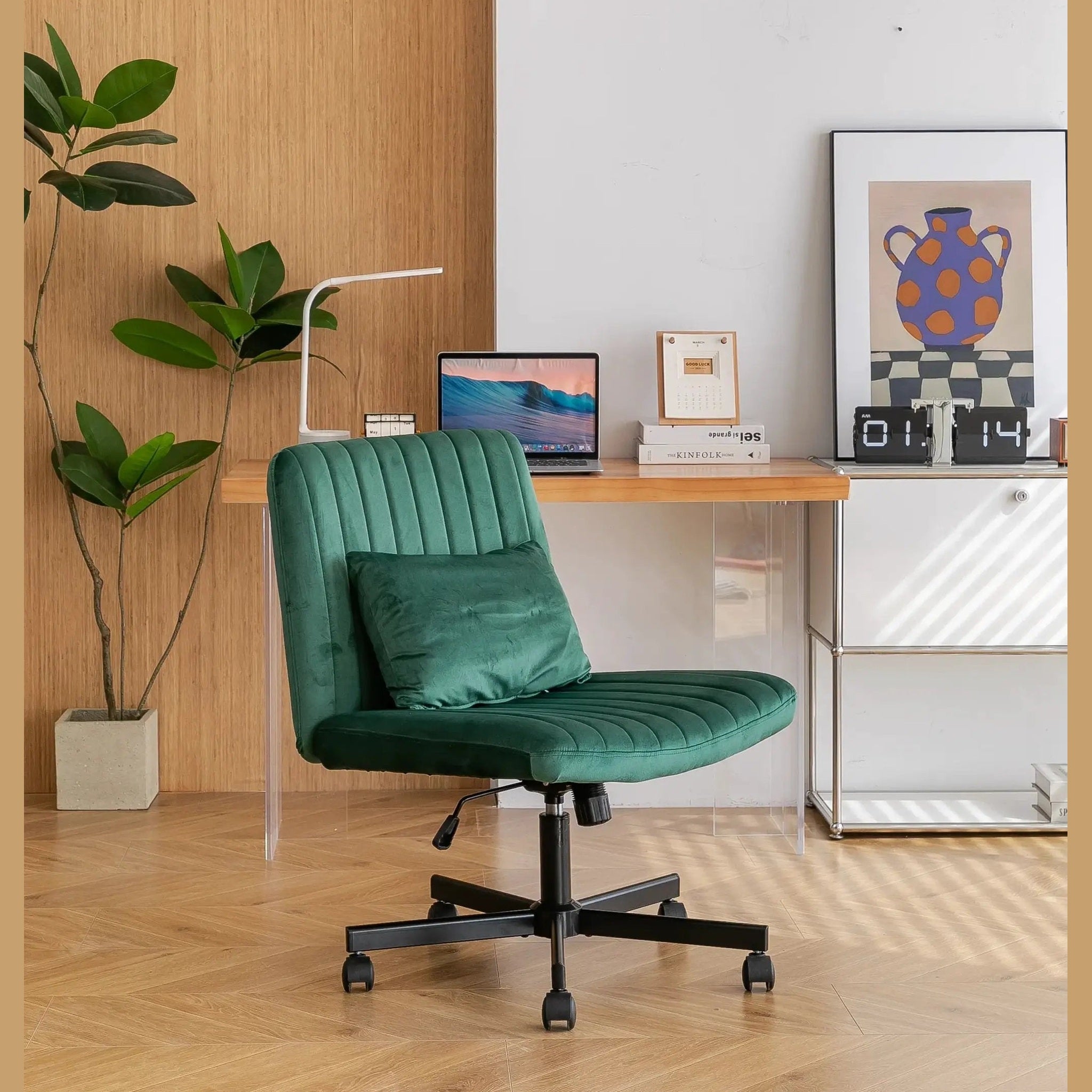Green velvet armless office chair with criss-cross design, wheels, and ergonomic support by Platinum-Level Office Chairs.
