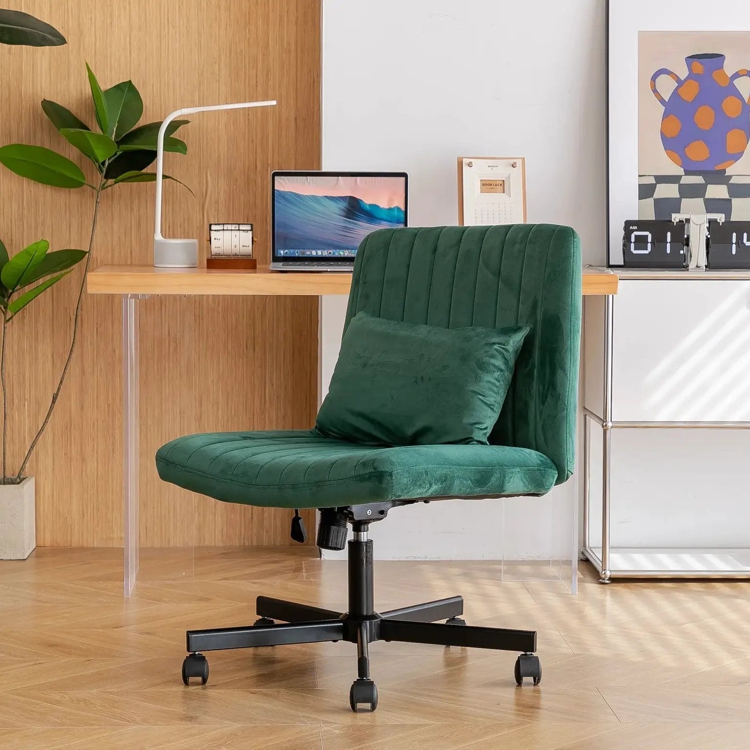 Green velvet armless office chair by Platinum-Level Office Chairs featuring criss-cross design, wheels, and ergonomic comfort.