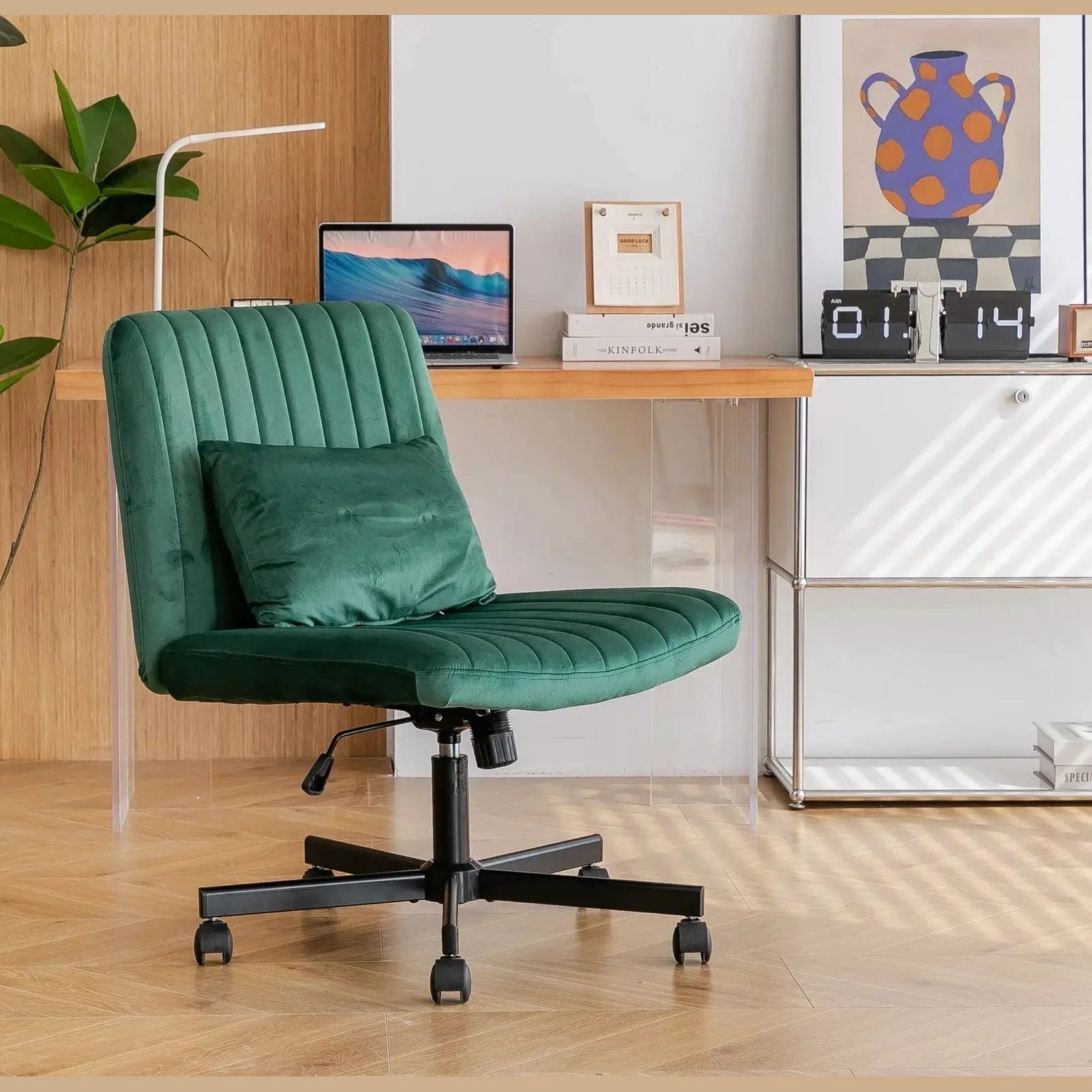 Green velvet armless office chair with criss-cross design, wheels, and ergonomic support from Platinum-Level Office Chairs.