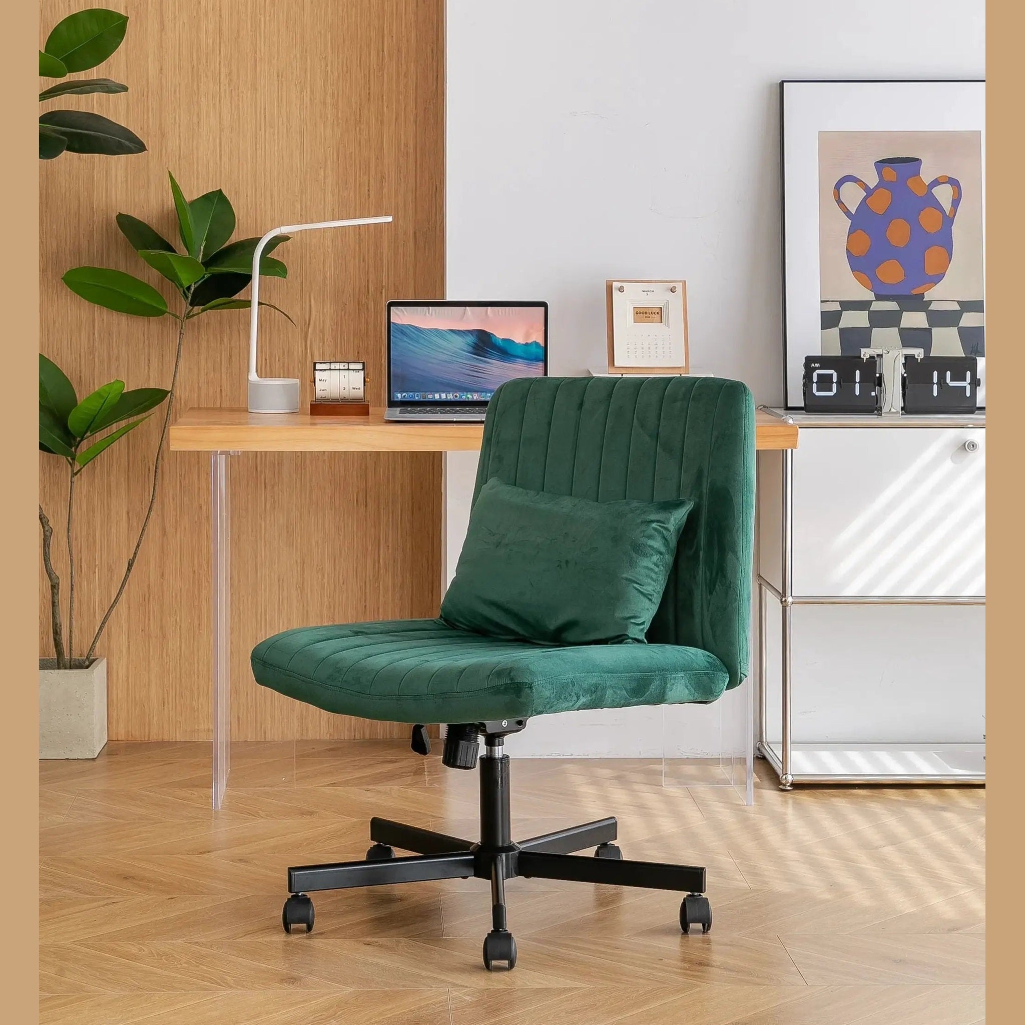 Green velvet armless office chair with criss-cross design, wheels, and ergonomic features by Platinum-Level Office Chairs.