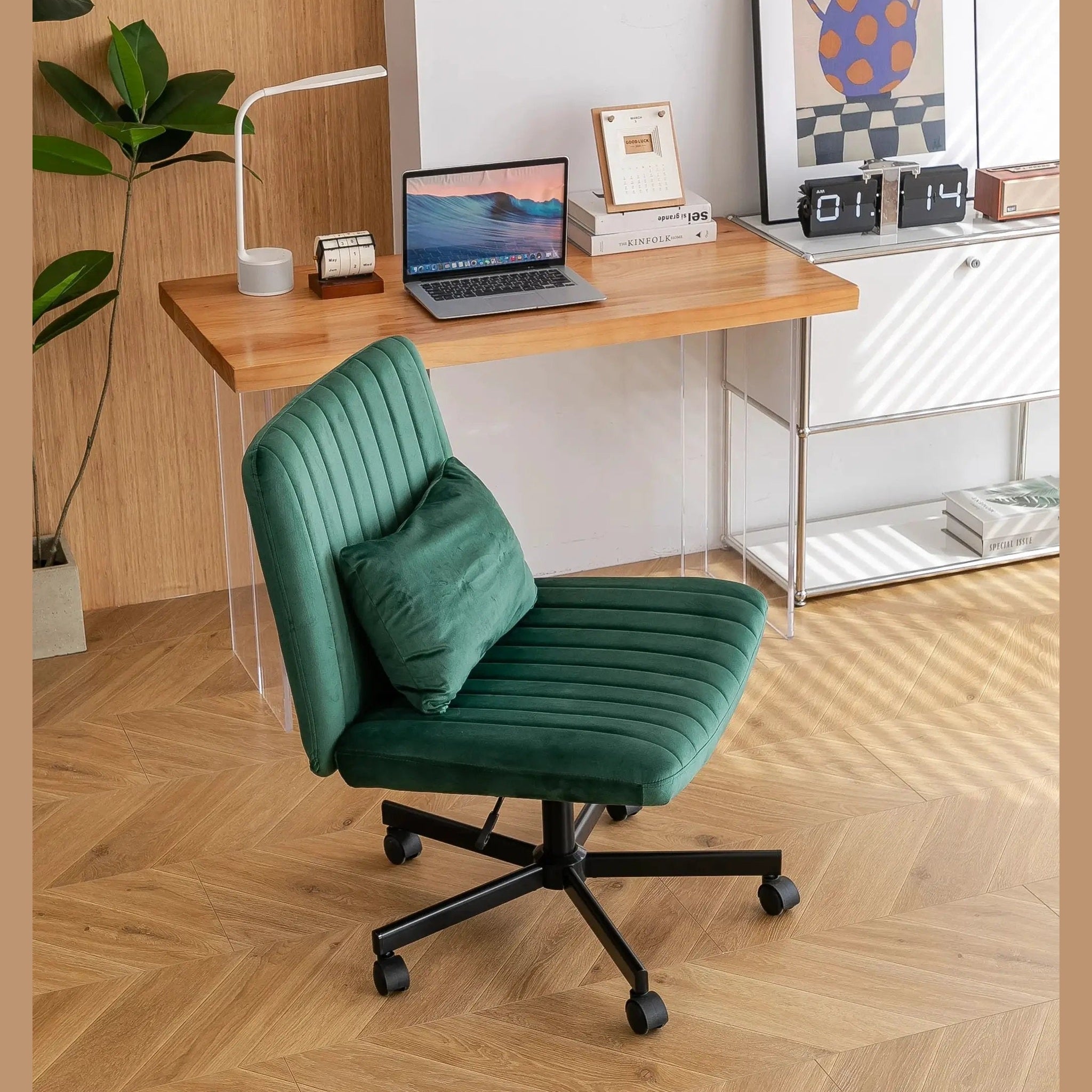 Green velvet criss-cross armless office chair by Platinum-Level Office Chairs with wheels and ergonomic design.