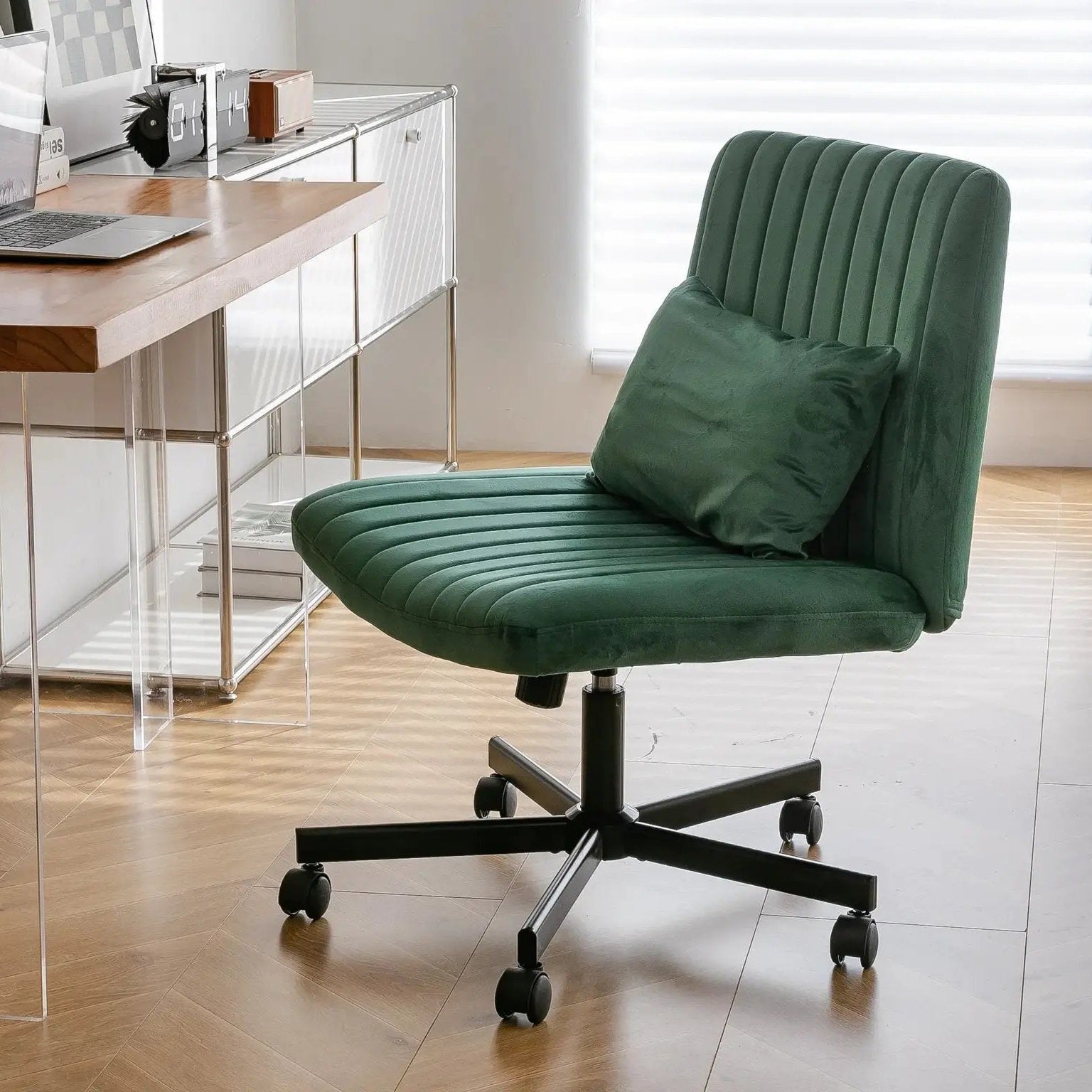 Green velvet armless office chair with criss-cross design, wheels, and ergonomic support by Platinum-Level Office Chairs.