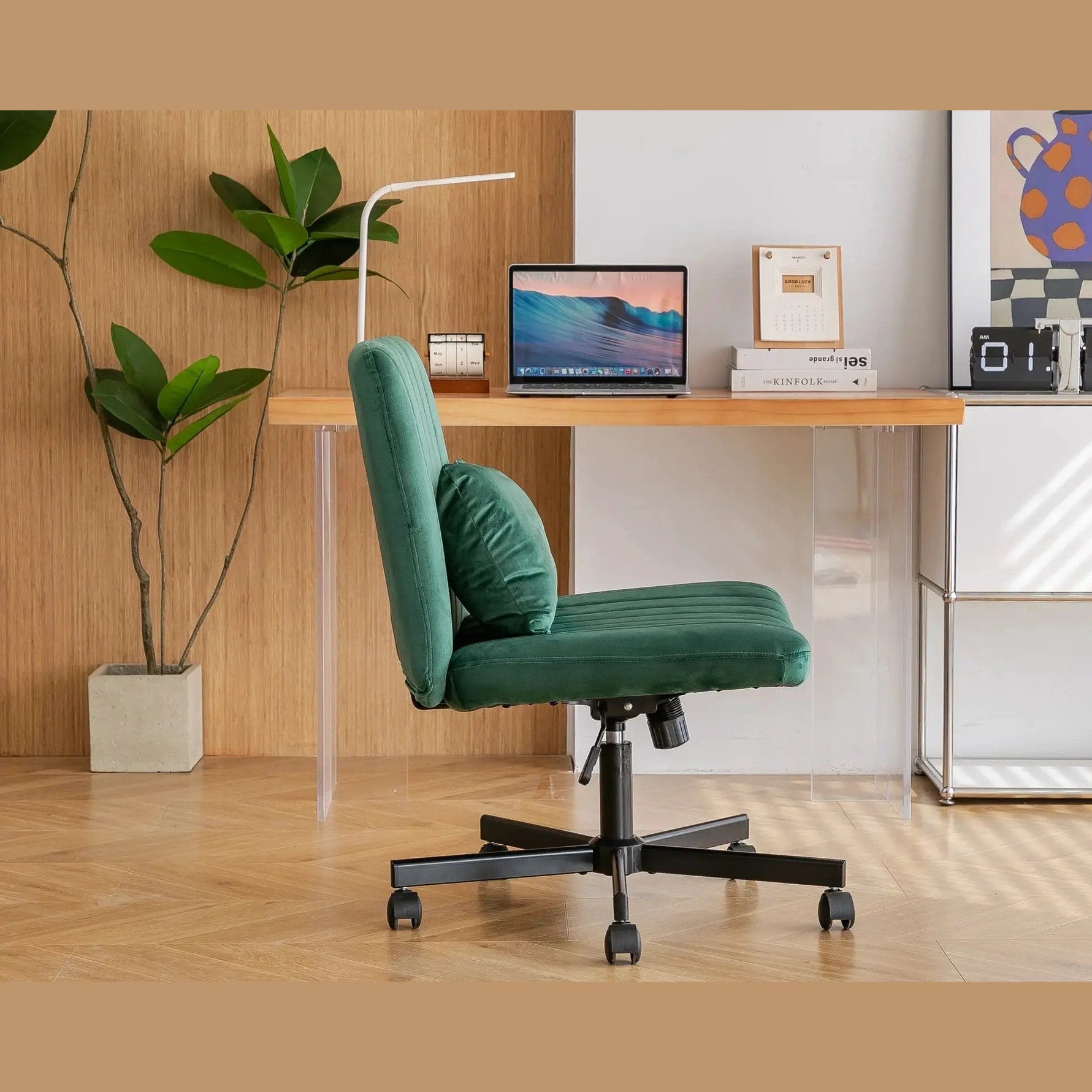 Green velvet criss-cross armless office chair with wheels, ergonomic design by Platinum-Level Office Chairs, suitable for modern workspaces.