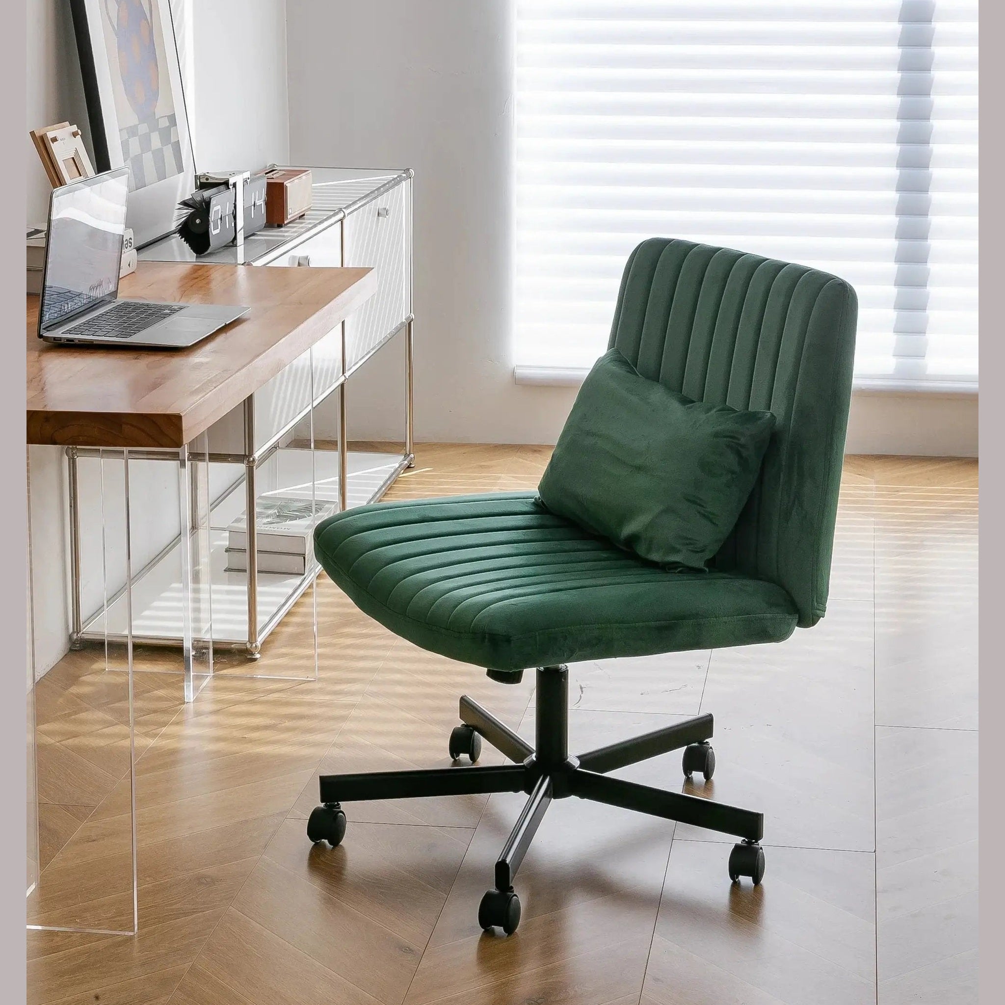Green velvet armless office chair with criss-cross design, wheels, and ergonomic support by Platinum-Level Office Chairs.