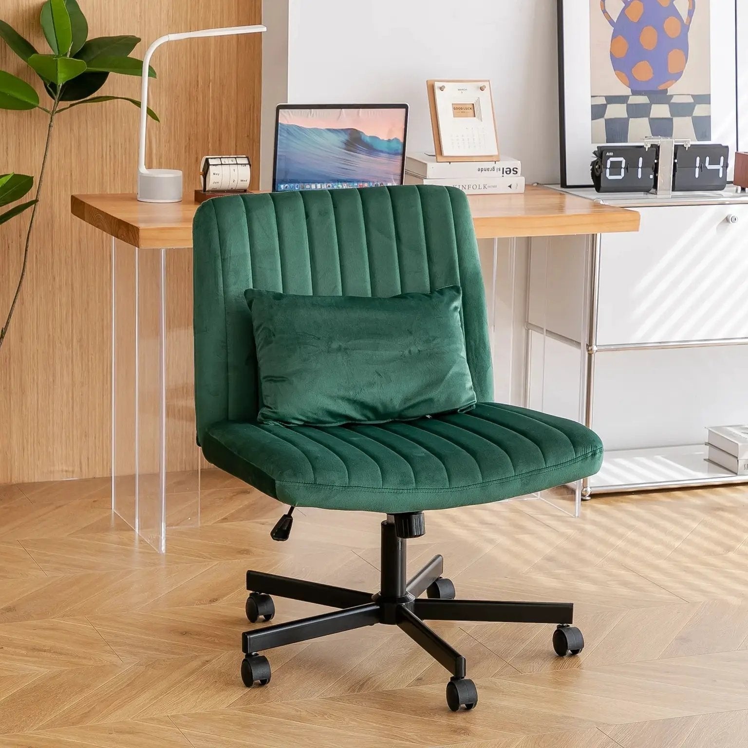 Green velvet armless office chair by Platinum-Level Office Chairs with criss-cross back, wheels, and ergonomic design.