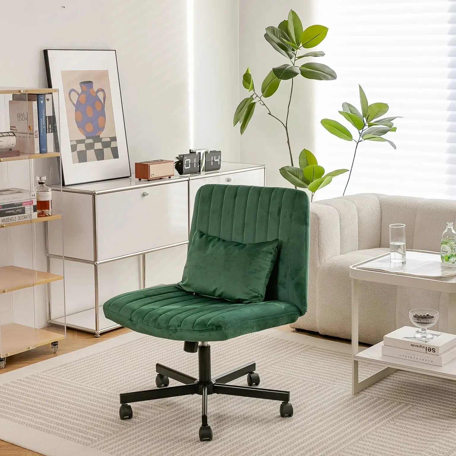 Green velvet office chair by Platinum-Level Office Chairs with criss-cross design, armless, wheels, and ergonomic support.