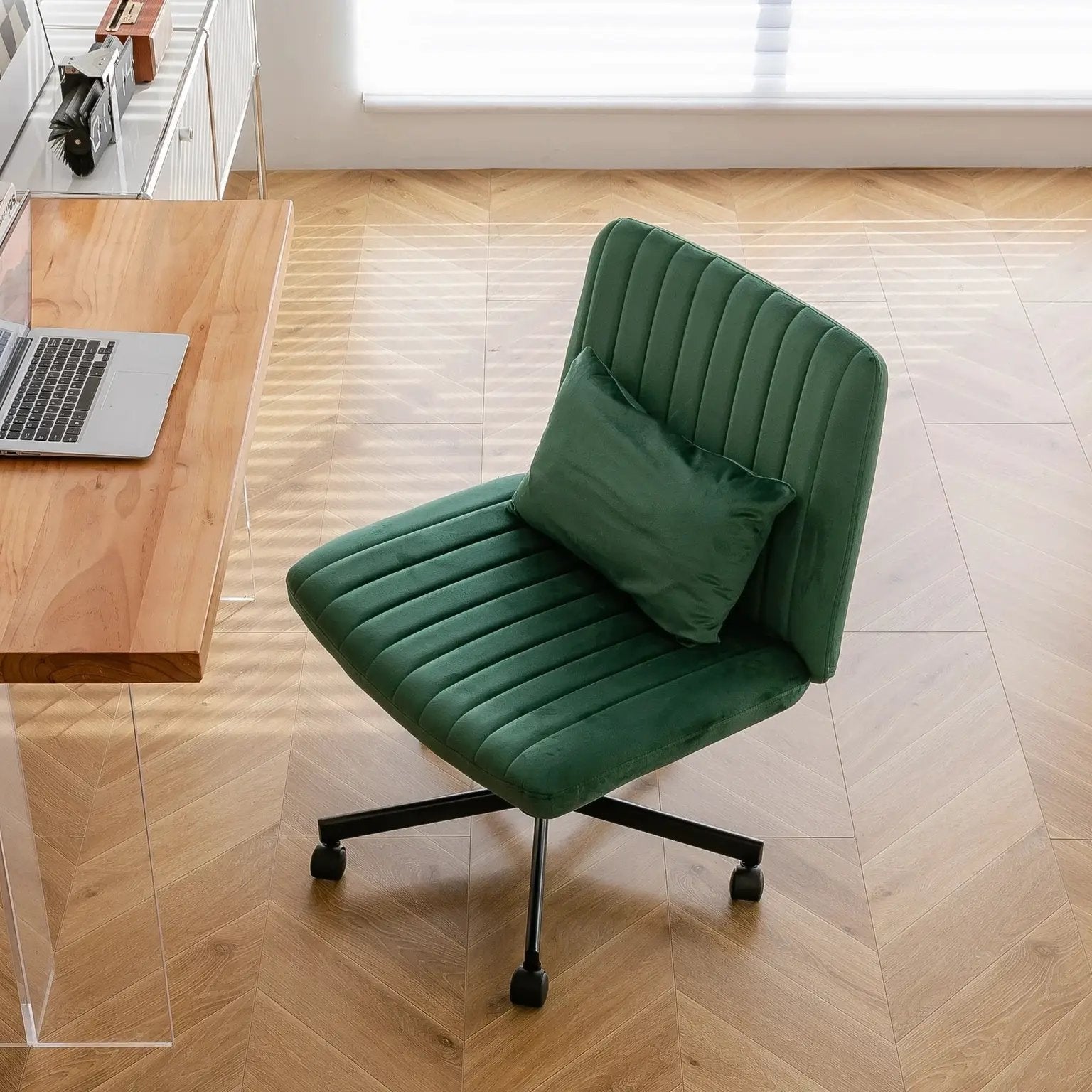 Green velvet criss-cross armless office chair with wheels, ergonomic design by Platinum-Level Office Chairs, suitable for modern workspaces.