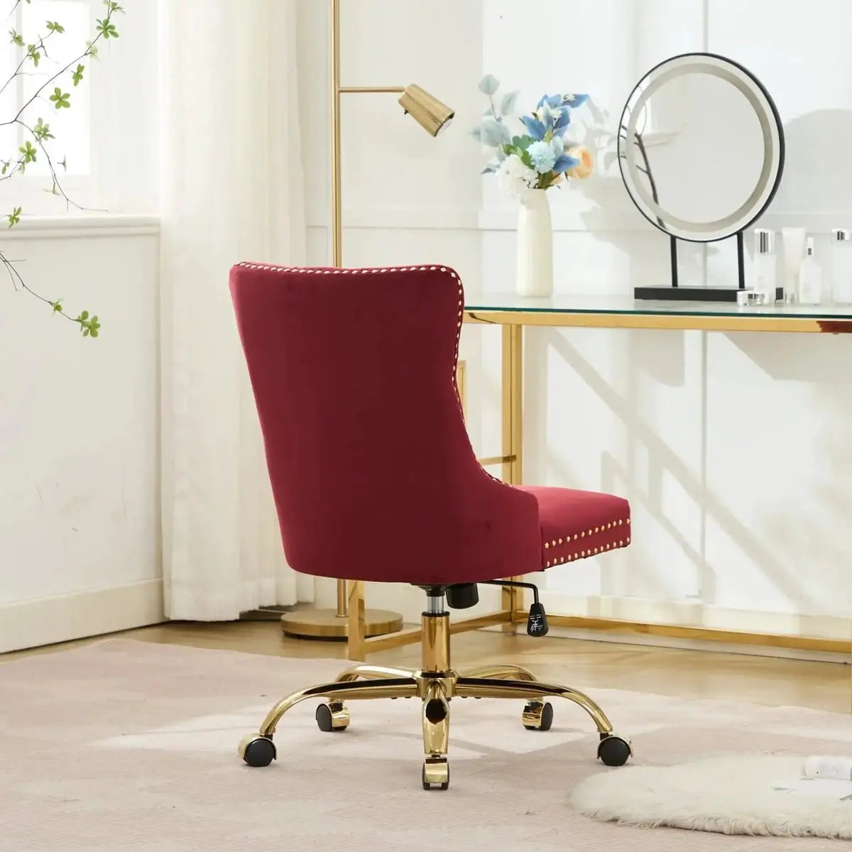 Luxurious wine red velvet swivel office chair with tufted design, gold base, and nailhead trim from Platinum-Level Office Chairs.