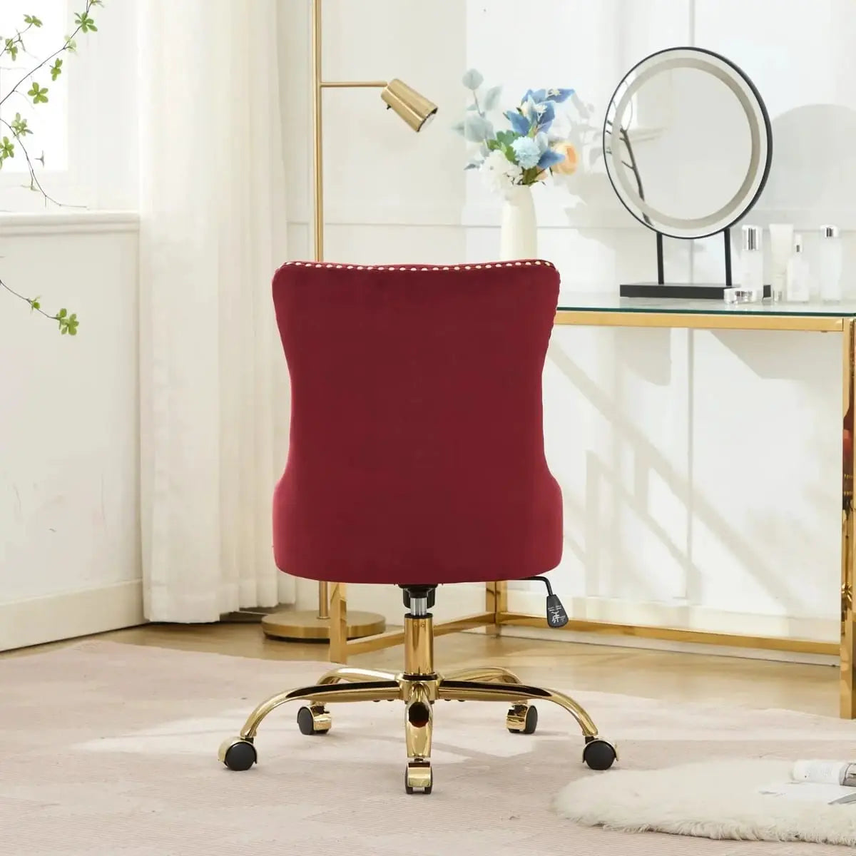 Wine red velvet tufted office chair with gold swivel base, showcasing American design elegance and luxurious comfort.