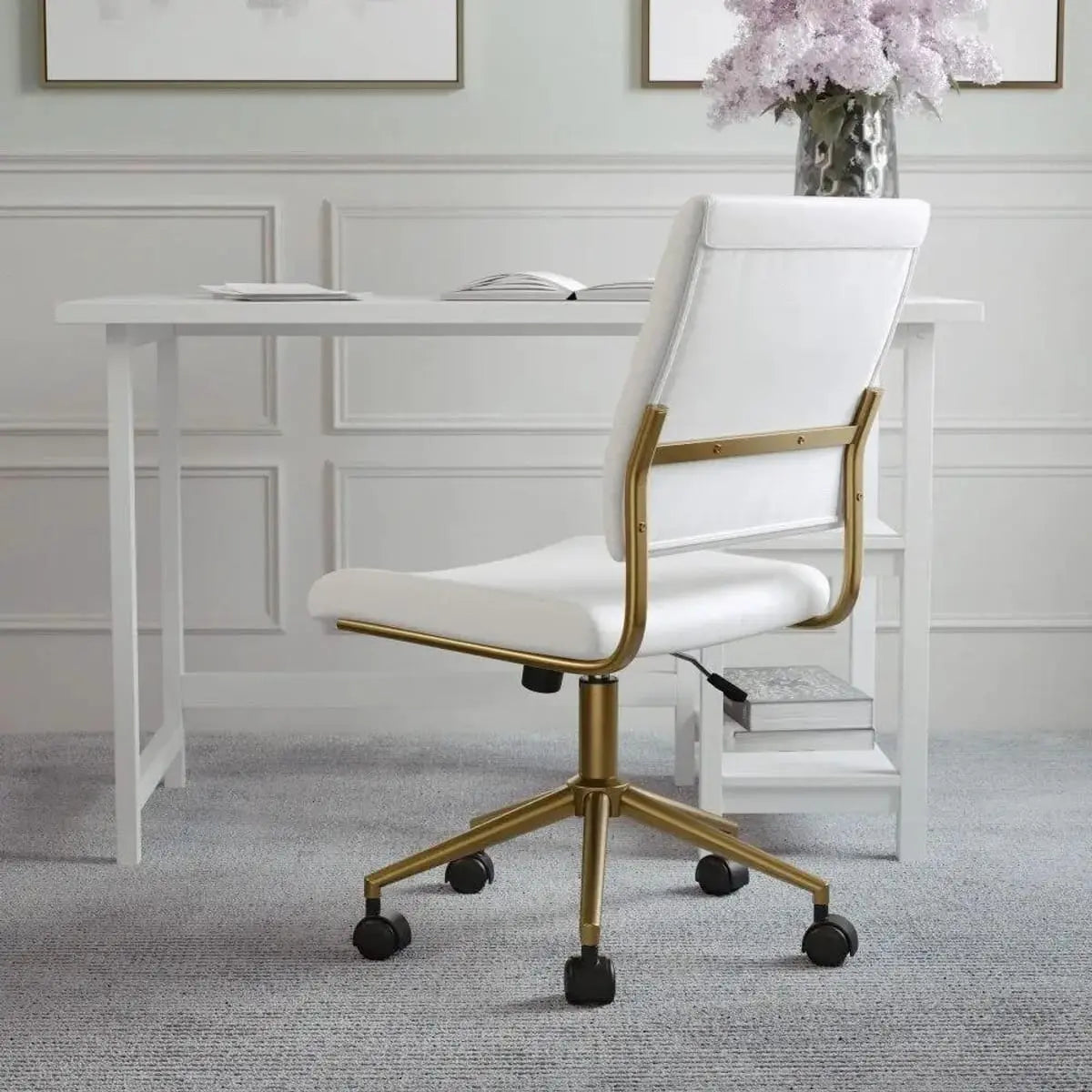 White faux leather armless swivel office chair by Platinum-Level Office Chairs with polished brass accents for home and desk use