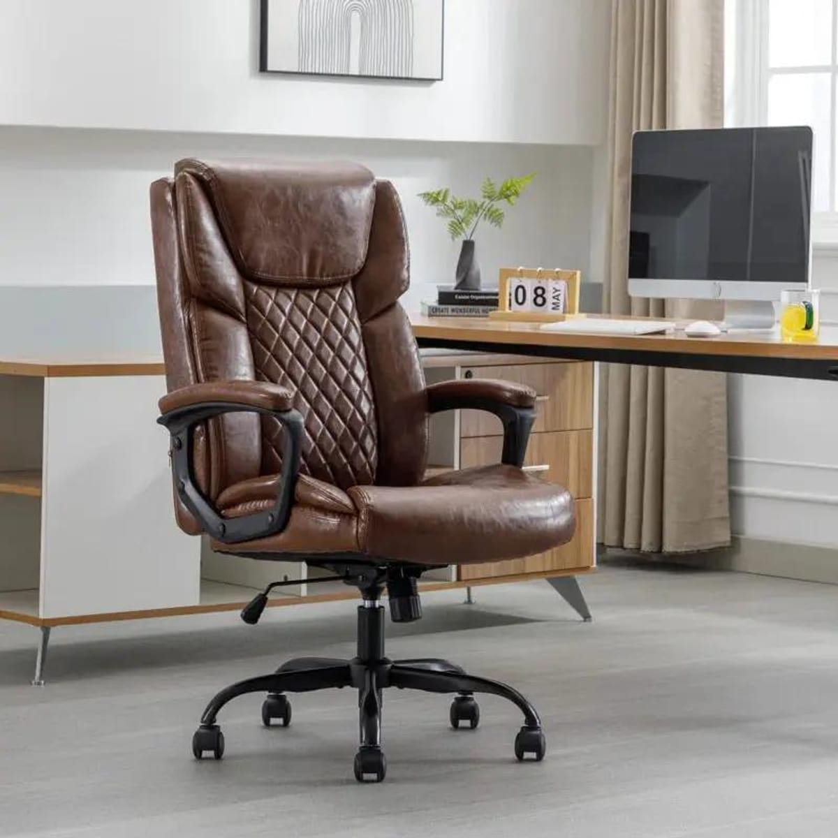 Red Barrel Studio big & tall ergonomic office chair with lumbar support, featuring a brown and red design for enhanced comfort.